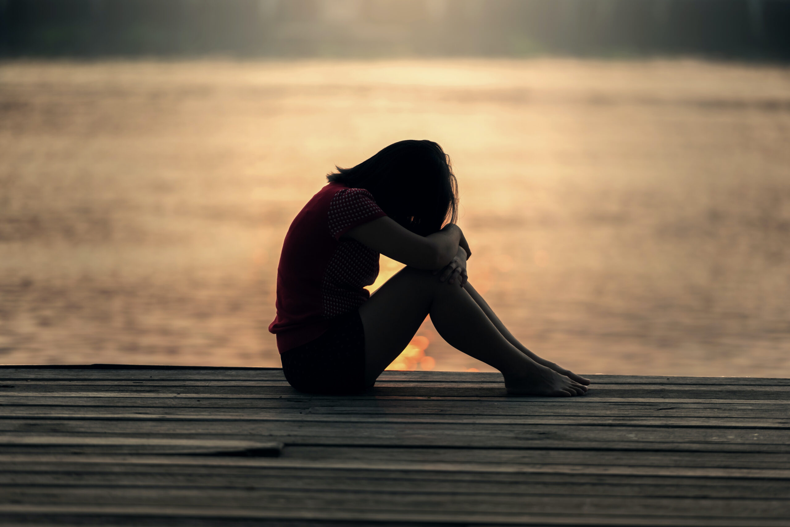 sad head down sad woman